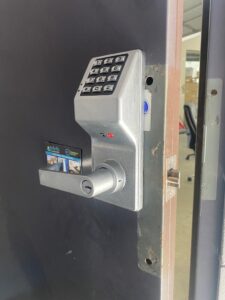 Keypad lock replacement by reliable locksmith on business exit door
